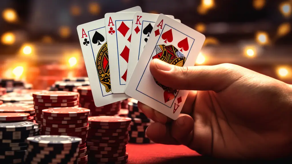 a hand holding card playing poker games